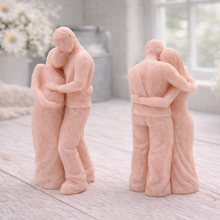 Load image into Gallery viewer, A 3D handmade vegan soap in a warm cream tone, sculpted into a standing figure of a pregnant couple; the partner stands behind the expectant mother, tenderly cradling her baby bump, displayed on a light wooden surface in a bright farmhouse setting.
