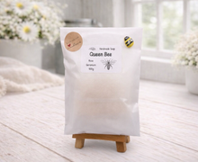 Load image into Gallery viewer, Packaged product labeled 'Queen Bee' on a wooden stand with a light background
