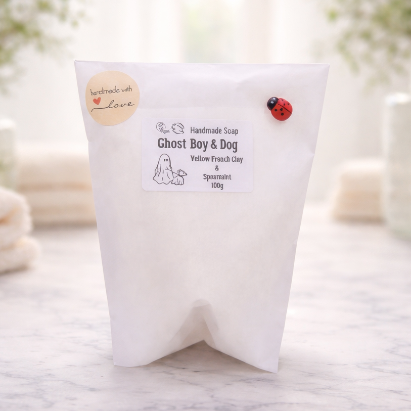 handmade vegan soap featuring a smiling ghost walking a small dog on a lead,