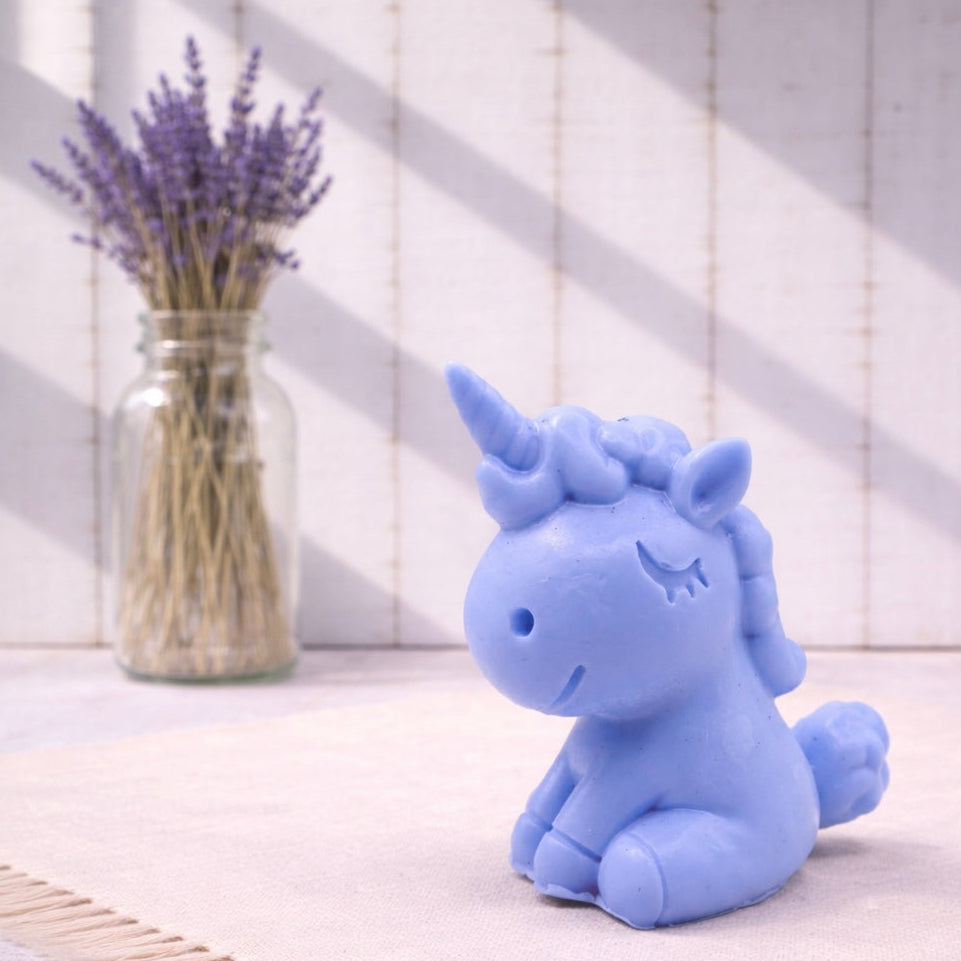 Handmade vegan soaps featuring a cute happy unicorn wrapped in beautiful eco friendly packaging. 